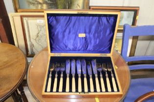 A cased set of fish knives and forks