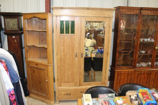 A striped pine mid fronted two door wardrobe fitte