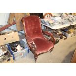 A Victorian mahogany button back scroll arm chair