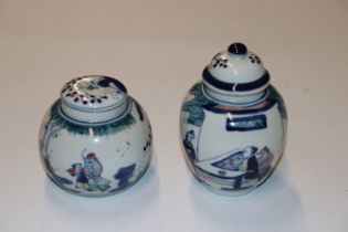 Two oriental ginger jars decorated with figures ha