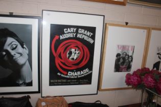 A framed Charade film poster