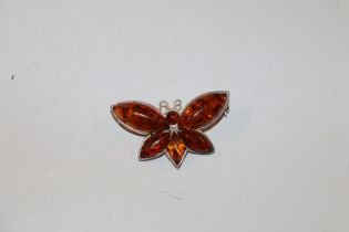 A sterling silver and amber set butterfly brooch