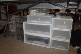 A quantity of Perspex and plastic storage boxes