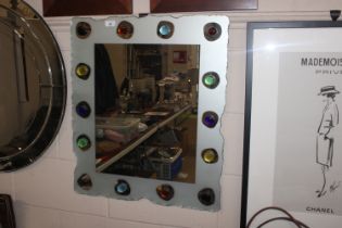 A murano type glass pebble applied wall mirror