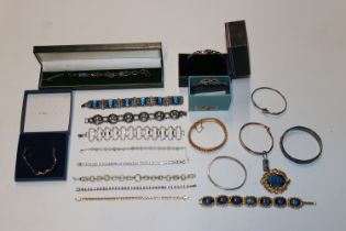 A box containing 925 silver and other bracelets an