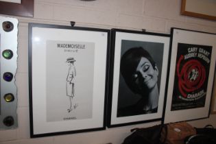 A framed print of Audrey Hepburn and a related Chanel print