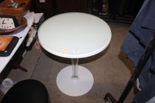 A Perspex and composite pedestal kitchen table