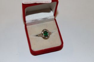 A 925 silver ring set with emerald coloured stone