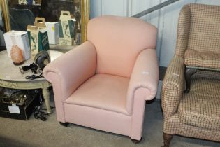 An early 20th Century upholstered deep seated armc
