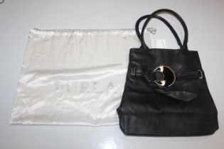 Three Furla lady's handbags, two black, one brown