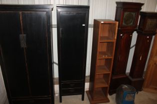 A Lombok slender black lacquer wardrobe fitted two