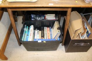 Two boxes of various books, wooden puzzle, prints