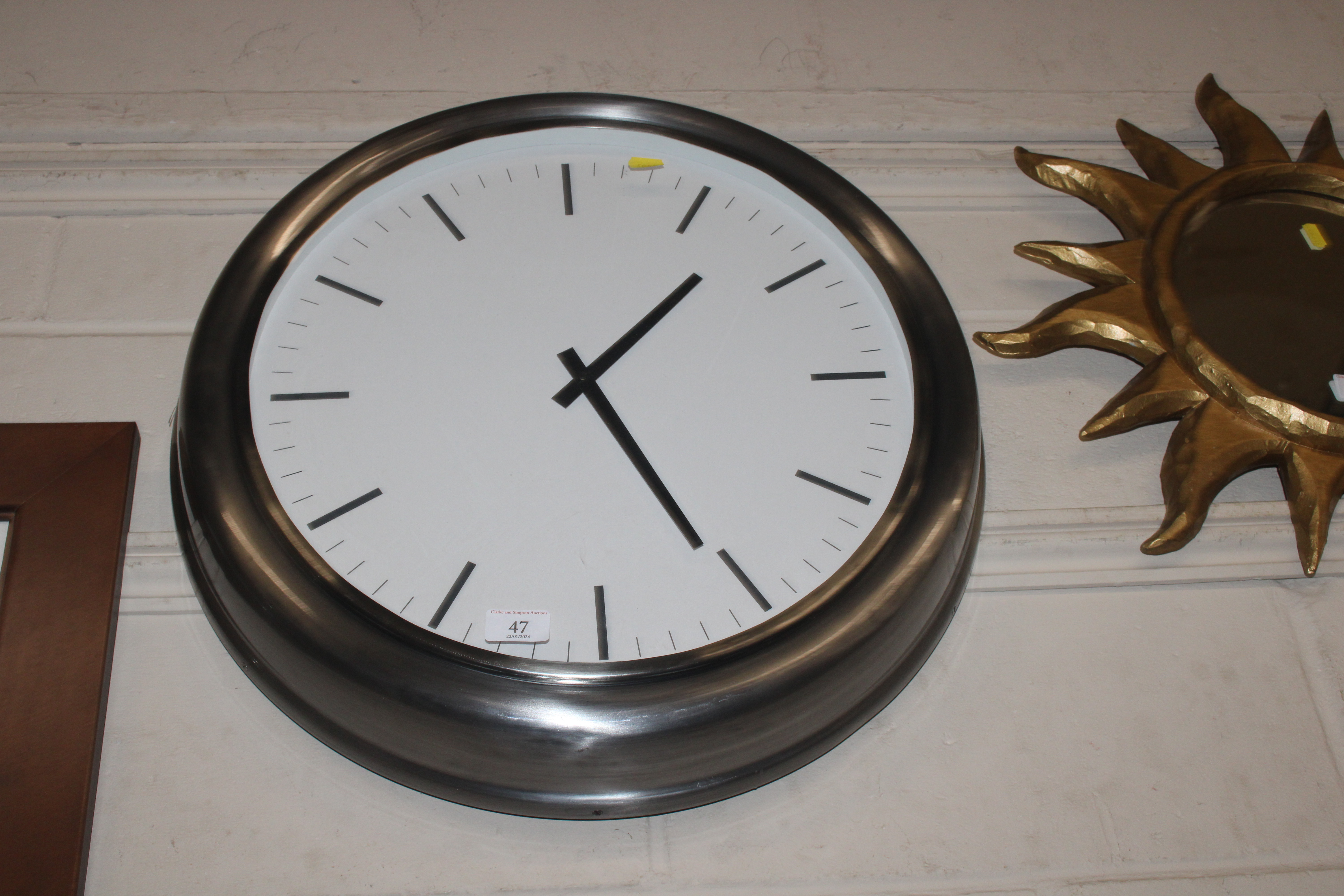 A French Connection wall clock of large proportion