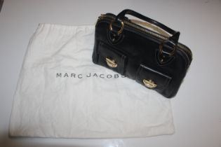 A Marc Jacobs black leather large handbag with dus