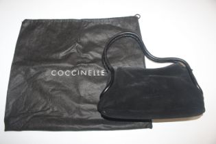 A Coccinelle suede leather handbag, a large attach