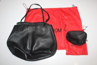 Three various Groom leather handbags and a related