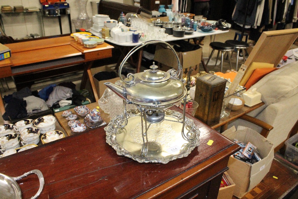 A silver plated spirit kettle on stand, a silver p