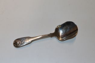A Georgian silver preserve spoon with shell decorated terminal and engraved stag design, hallmark
