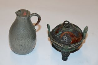 A censer and cover raised on three supports and a pewter jug with character mark to base