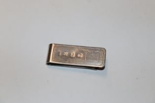 A silver money clip, hallmark Birmingham 1989