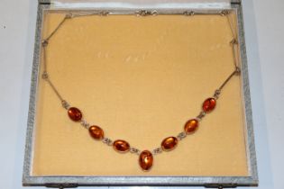 A vintage sterling silver and amber set necklace