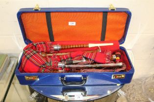 A cased set of John Mackainzei bagpipes