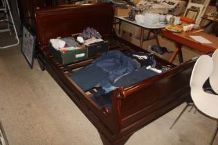 A mahogany double sleigh bed