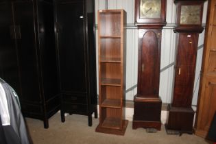 A black walnut and mirror backed revolving dressin