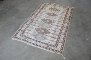 An approx. 6'10" x 4'2" floral patterned rug AF
