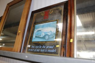A wooden framed advertising mirror for Rolls Royce
