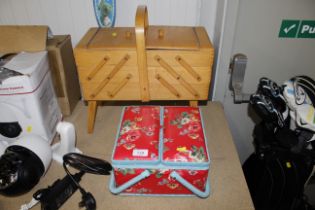 A wooden cantilever sewing box and various content