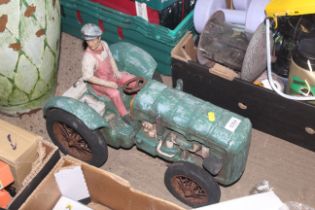 A model of a farmer sitting on a tractor