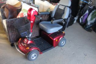 A FreeRider mobility scooter with charger, front b