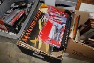 A box containing two Airfix models, various arts a