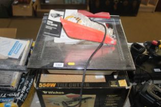 A Wickes 550W tile cutter with instruction guide,