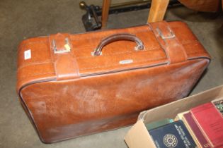 A Custom leather travel suitcase and a leather cas