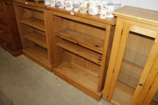 A pine three tier adjustable open fronted bookcase