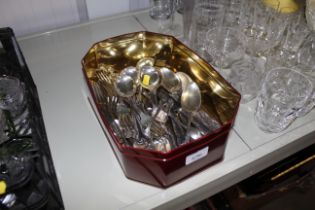 A tin of various cutlery