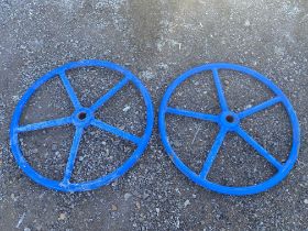 A pair of blue implement wheels