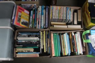 Four boxes of books containing various examples of