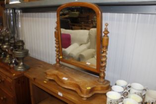 A swing framed toilet mirror with barley twist sup