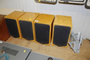 Four Quad 77-11L speakers contained with a faux wa