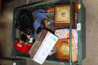 A tray containing various tins, clocks, barometer,