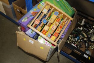 A box containing various toys, games, children's a