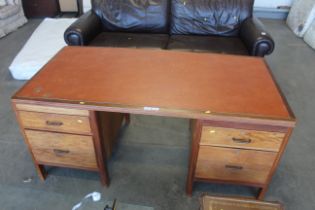 A twin Pedi stool leather top desk
