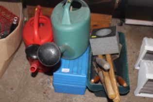 Two plastic watering cans and two boxes of various