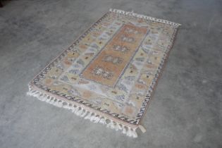 An approx. 7'2" x 4'2" Eastern pattered rug AF