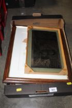 A box containing various pictures and prints
