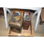 A wooden box and contents of various tins