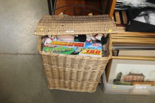 A wicker laundry basket and contents to include Wa